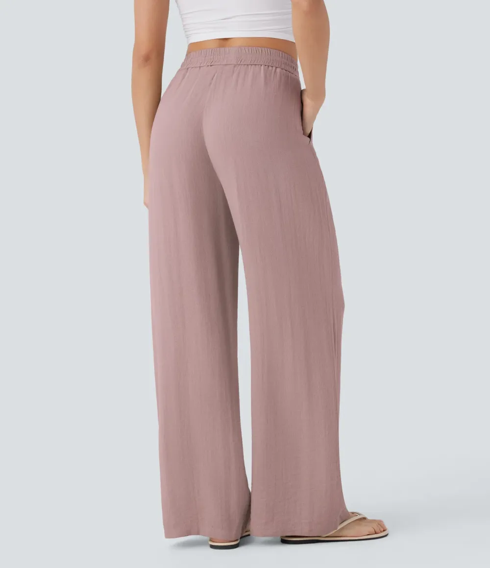 2026🔥  Wide-leg, flowing, high-waisted trousers with drawstring, side pockets and a linen look