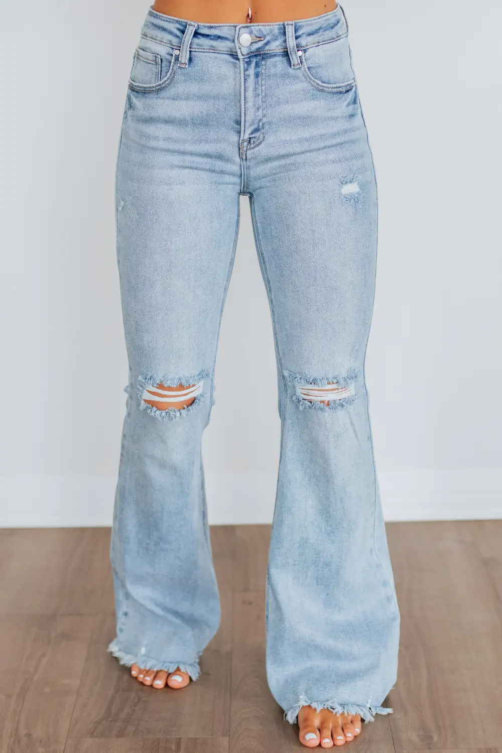 Women's High Rise Flared Leg Raw Hem Jeans