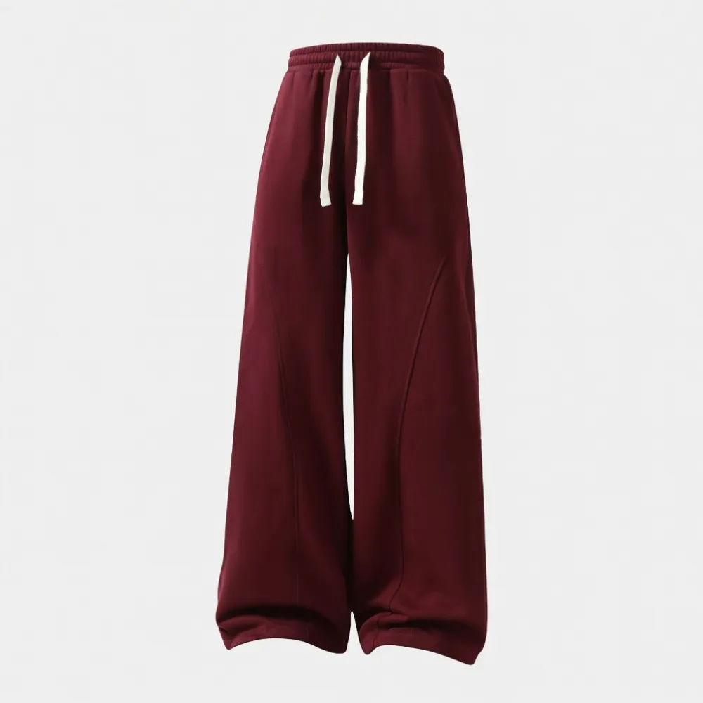 Men's solid-color drawstring trousers with curved hems—casual and comfortable, featuring a relaxed fit suitable for all seasons.