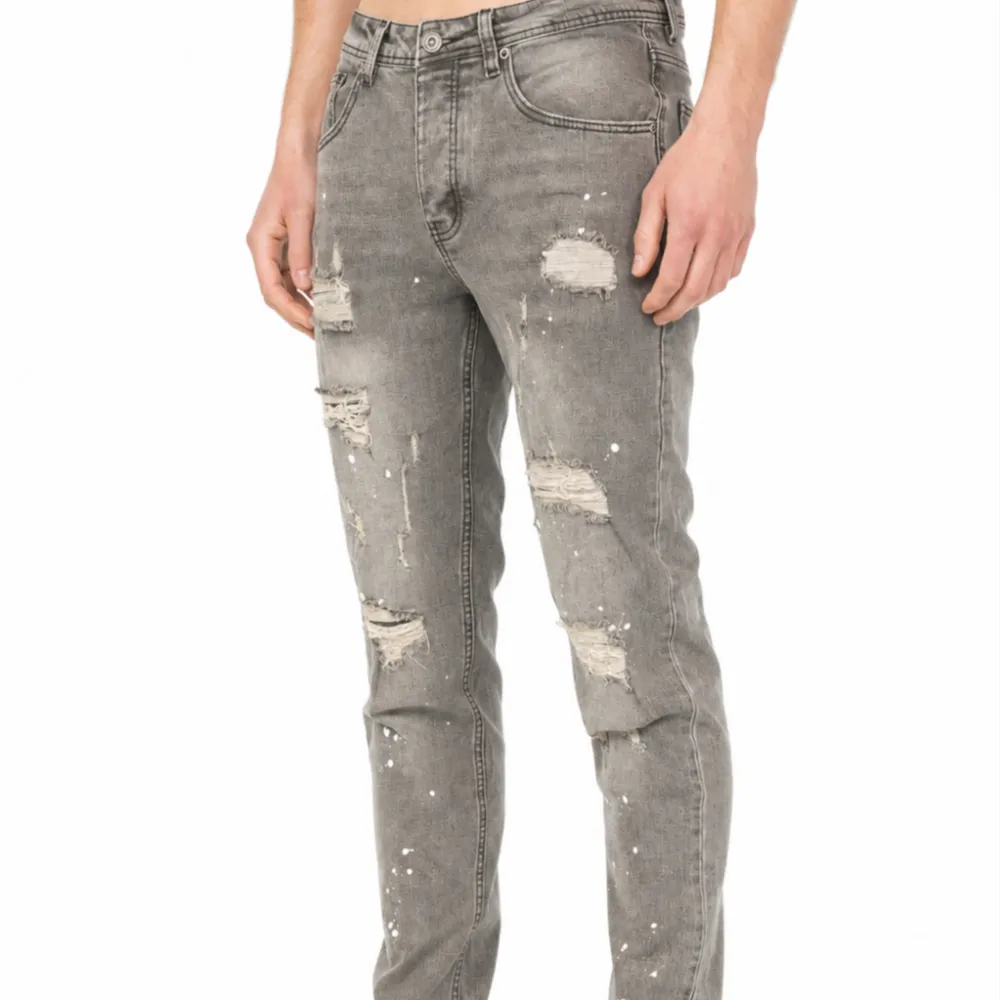 Distressed Slim Fit Paint Splatter Five Pocket Jeans