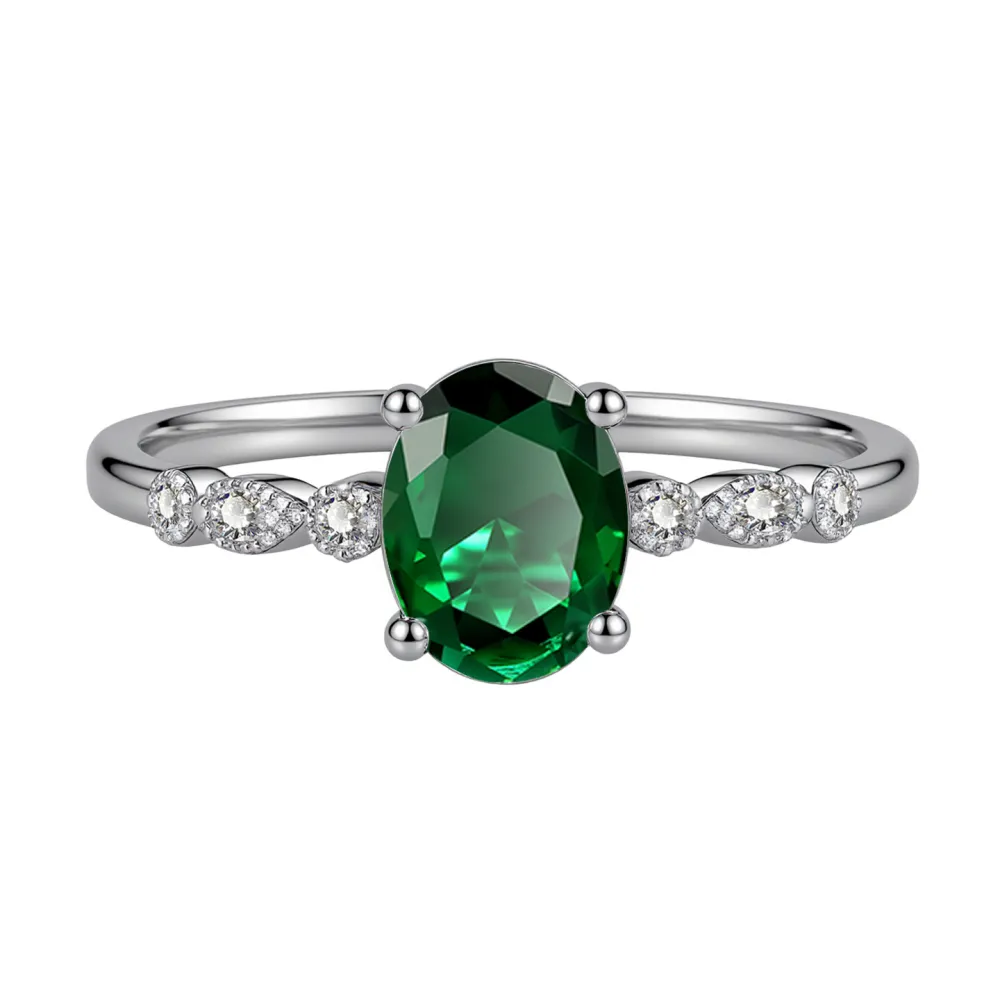 Elegant, delicate, and effortlessly beautiful. This oval gemstone ring features a brilliant faceted center stone surrounded by sparkling accents for a timeless, feminine look.