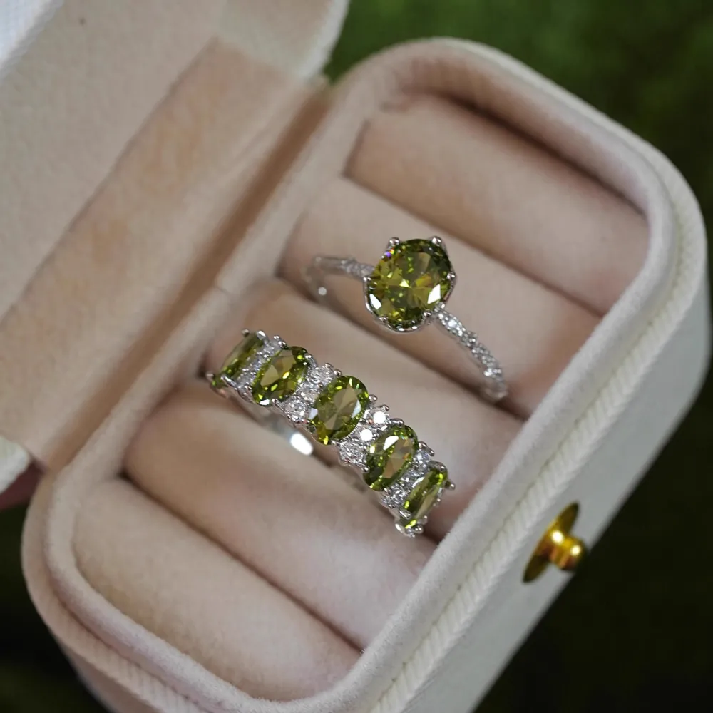 ✨ A little sparkle. A lot of elegance. The rich olive-green stones paired with a delicate silver-tone setting create a look that feels effortlessly luxurious.  Wear it alone for a refined touch or stack your favorites for extra sparkle. 💚