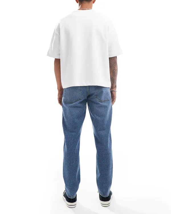 Tapered Jeans With Abrasions In Midwash Blue