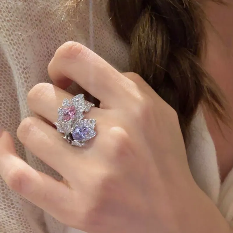 ✨ The kind of ring people can’t stop staring at. A dreamy mix of pink & lavender sparkle wrapped in an elegant leaf-inspired design. 💗💜