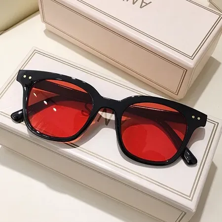 🕶️ Your Outfit’s New Favorite Accessory  Classic black frames meet bold tinted lenses for an effortlessly stylish look.