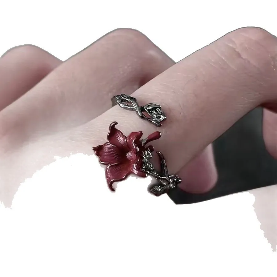 🌹 A Rose That Never Fades.  Dark, romantic, and beautifully unexpected. This vintage-inspired floral ring wraps around your finger like a tiny blooming vine, finished with a deep red flower that instantly catches the eye.