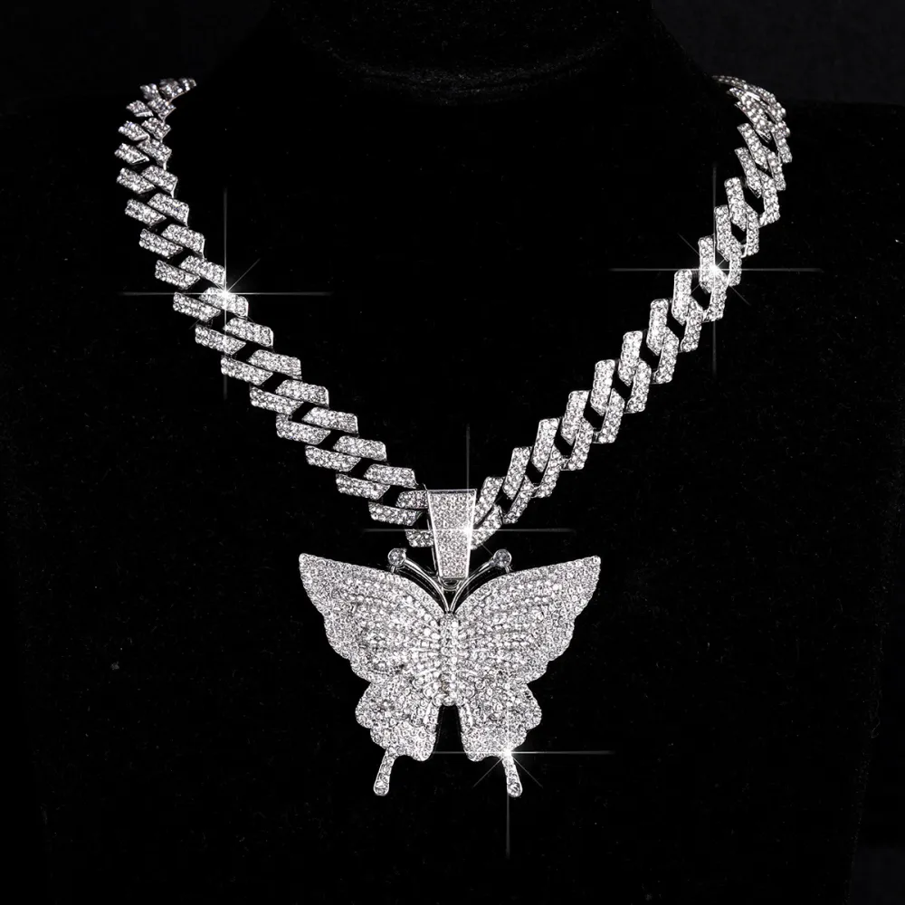 🦋 MAKE YOUR LOOK HIT DIFFERENT. ✨  Turn heads with an Iced-Out Butterfly Pendant that brings serious shine to every fit. Bold Cuban-link style. Statement butterfly design. Maximum sparkle from every angle. 💎