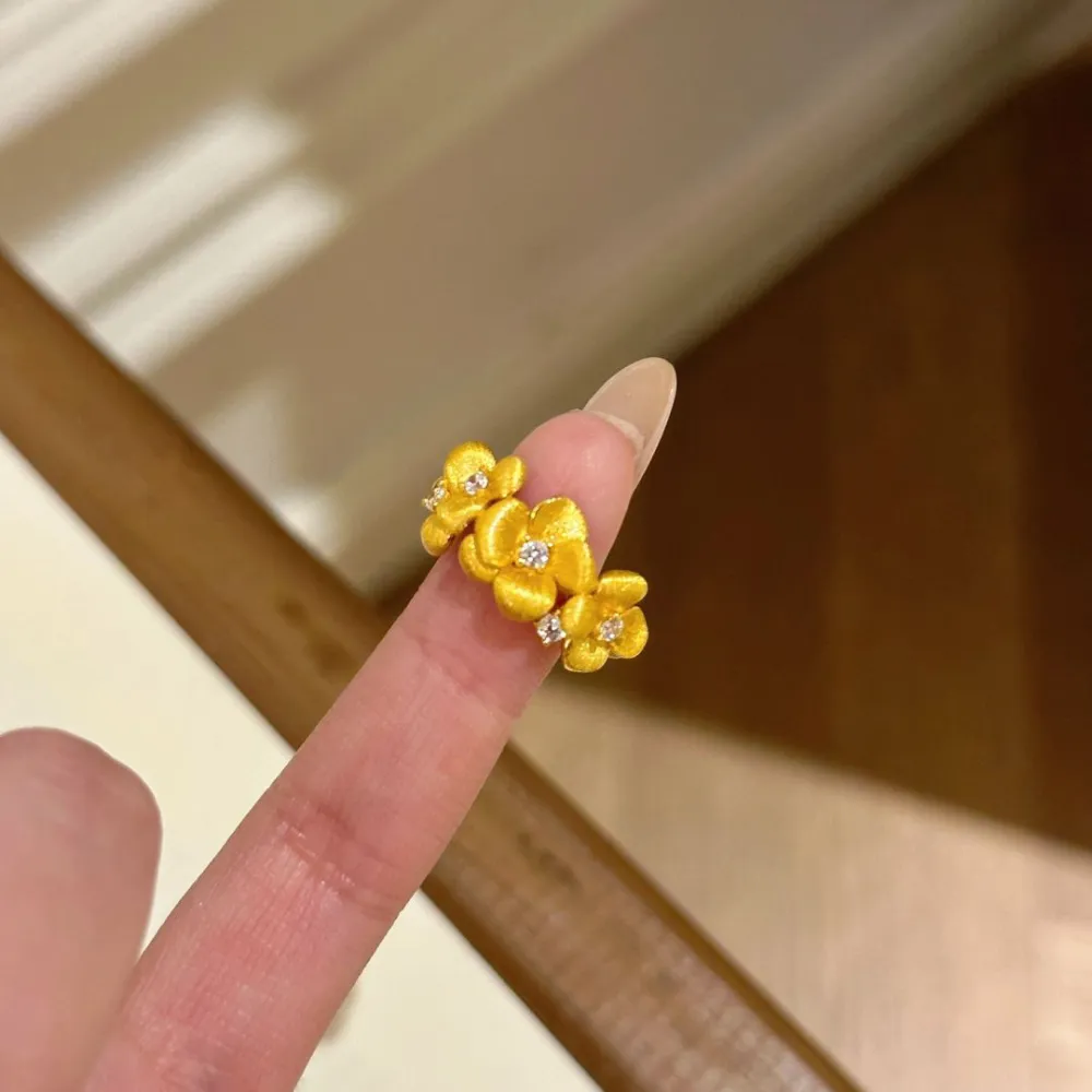 The Golden Blossom Ring turns delicate flowers into an eye-catching piece of jewelry.  Its textured petals catch the light beautifully, while sparkling crystal accents add just enough shine without feeling overdone.  Perfect with dresses, everyday outfits