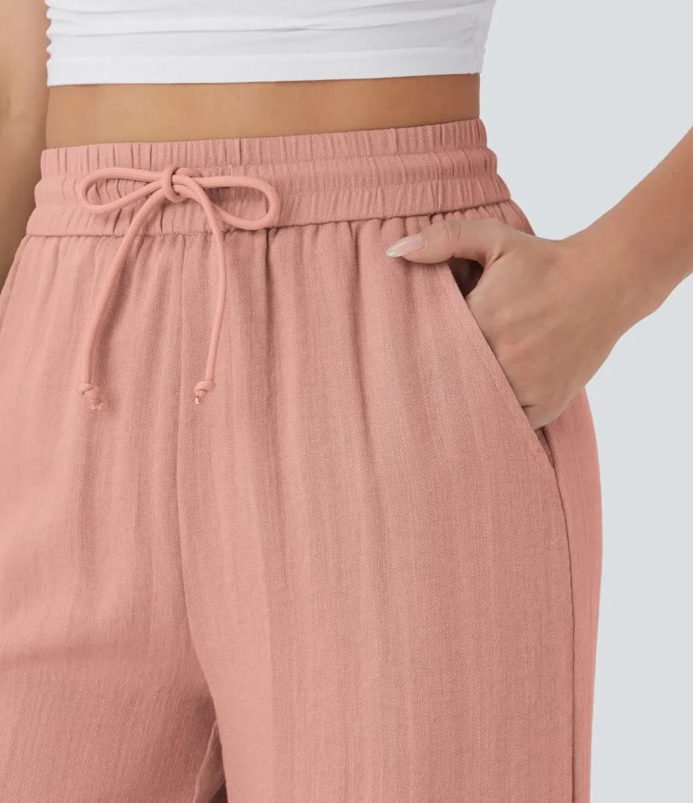 2026🔥  Wide-leg, flowing, high-waisted trousers with drawstring, side pockets and a linen look