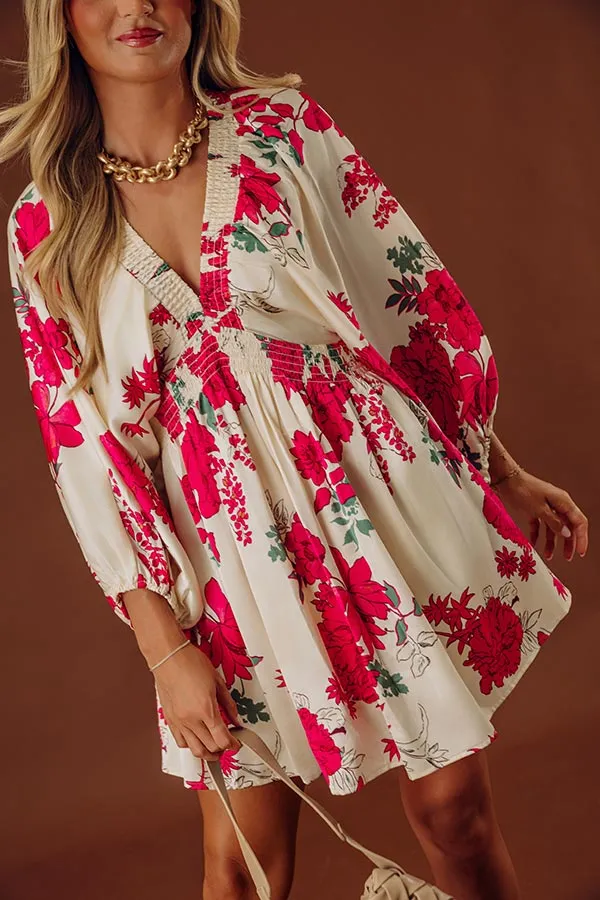 Pocketed Floral V-Neck Long Sleeve Smocked Mini Dress