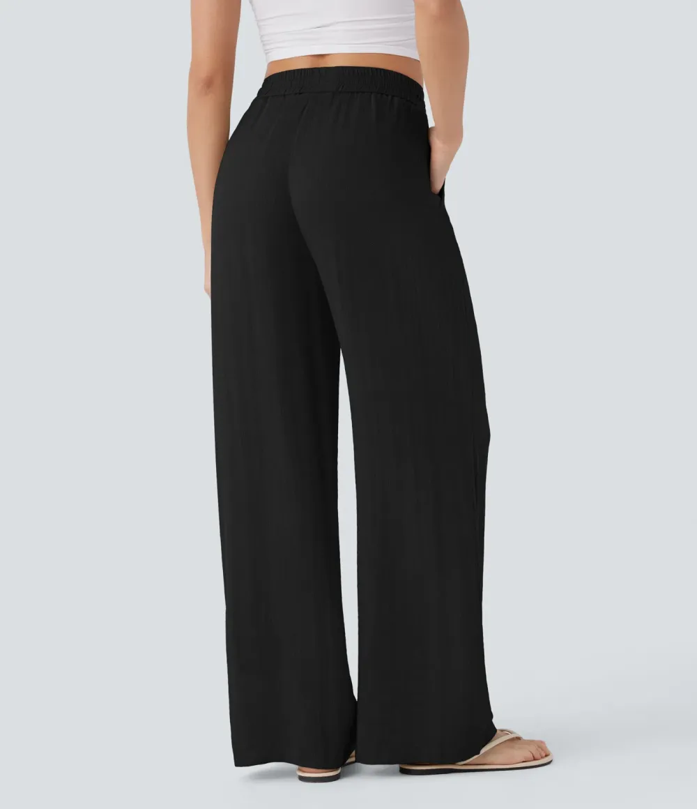 2026🔥  Wide-leg, flowing, high-waisted trousers with drawstring, side pockets and a linen look