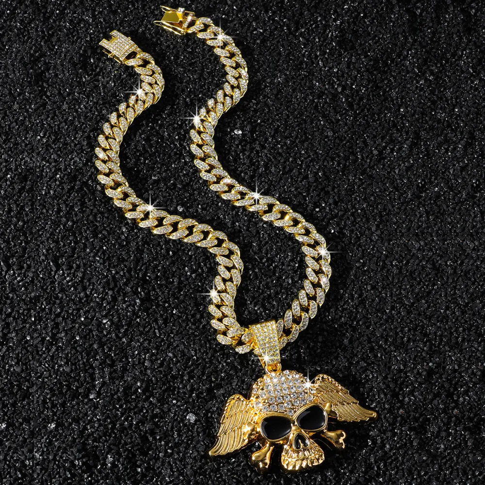 💀 NOT MADE TO BLEND IN. 🔥  Turn heads the second you walk in.  This iced-out Cuban chain features a bold winged skull pendant, packed with eye-catching shine and serious street attitude. Whether you choose Gold or Silver, this piece instantly upgrades y