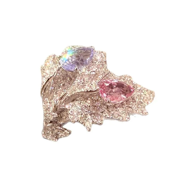 ✨ The kind of ring people can’t stop staring at. A dreamy mix of pink & lavender sparkle wrapped in an elegant leaf-inspired design. 💗💜