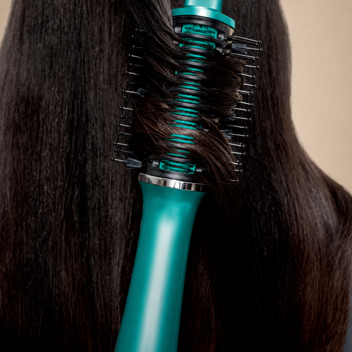 Close view of hair moving through the heated brush