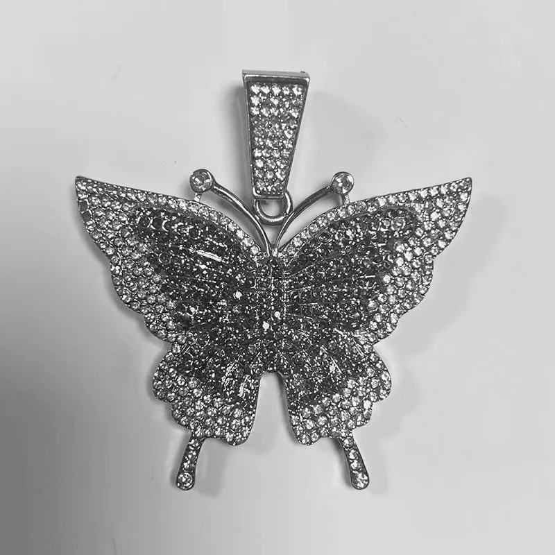 🦋 MAKE YOUR LOOK HIT DIFFERENT. ✨  Turn heads with an Iced-Out Butterfly Pendant that brings serious shine to every fit. Bold Cuban-link style. Statement butterfly design. Maximum sparkle from every angle. 💎